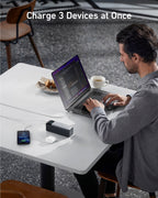 Anker charging 3 devices with laptop and coffee